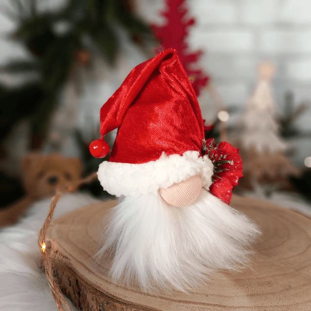 Tomte lutin père Noël à la fleur rouge
