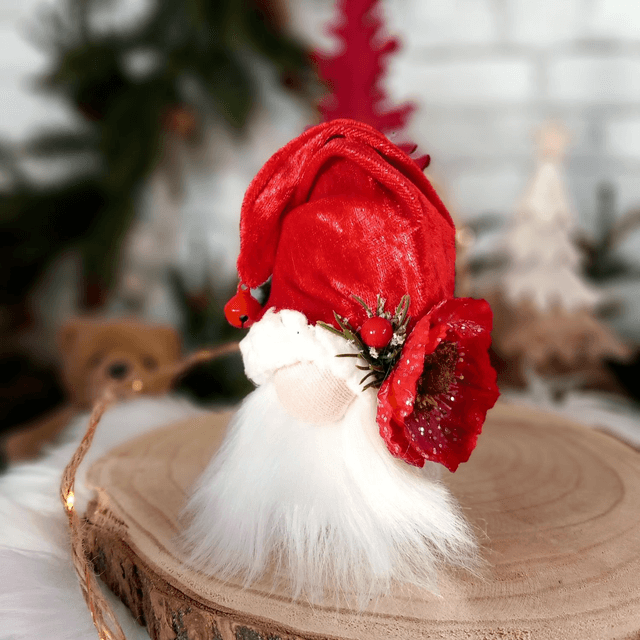 Tomte lutin père Noël à la fleur rouge