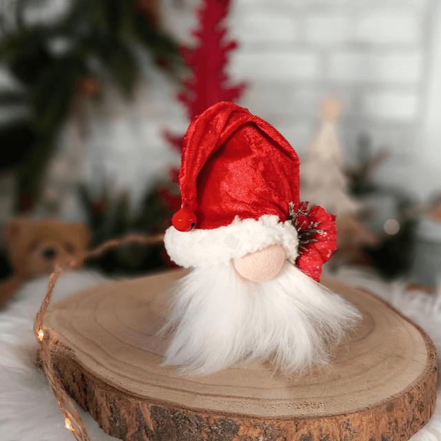 Tomte lutin père Noël à la fleur rouge